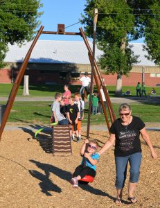 3 year old Lockwood resident Zoe Sherman rides on the new zip line while Grandma Bonnie Huck helps her along during the grand opening celebration of the new Lockwood Lion’s Lair 2.0 on Friday September 16. (Photo Jonathan McNiven-Yellowstone County News)